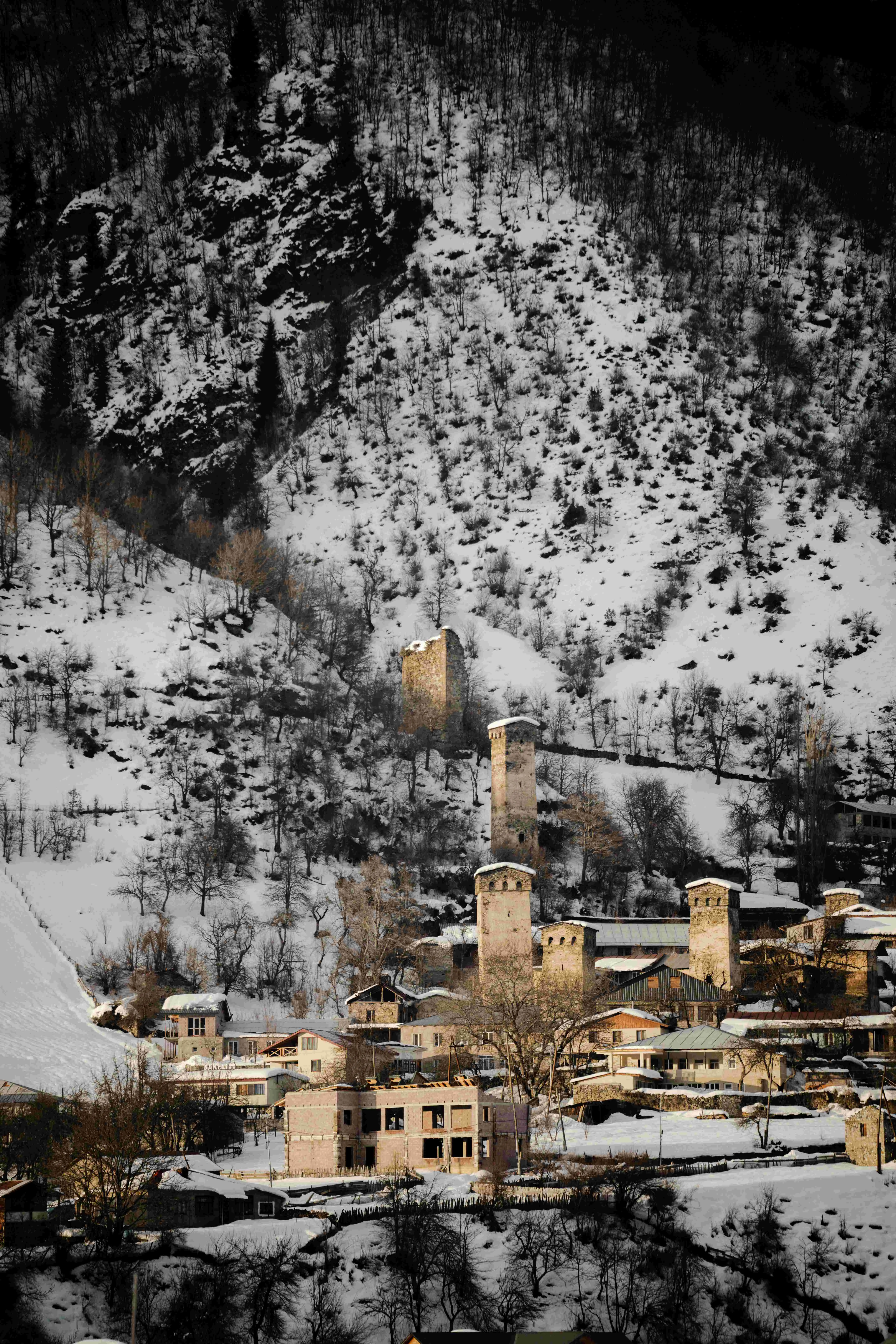 Zemo Svaneti is in <span class="text-red-500">Mestia Municipality,</span> a high-mountain region and hotspot of tourism and alpinism, with alpine nature, clear lakes, the Enguri River and its rapid tributaries, and divine waterfalls.<br/> The noble peaks of the Caucasus Mountains stand tall in Zemo Svaneti, such as <span class="text-red-500">Shkhara</span> (5,203 m), Jangha (5,078 m), Gistola (4,860 m), <span class="text-red-500">Tetnuldi</span> (4,852 m), Tsurungala (4,222 m), Ailama (4,547 m), Mazeri (4,012 m), Chatini (4,412 m), and Ushba (4,700 m).